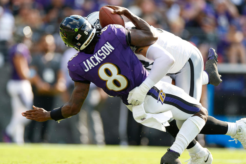 BALTIMORE, MARYLAND - SEPTEMBER 15: Maxx Crosby #98 of the Las Vegas Raiders tackles Lamar Jackson #8 of the Baltimore Ravens during the fourth quarter during an NFL football game at M&T Bank Stadium on September 15, 2024 in Baltimore, Maryland. (Photo by Brandon Sloter/Getty Images)