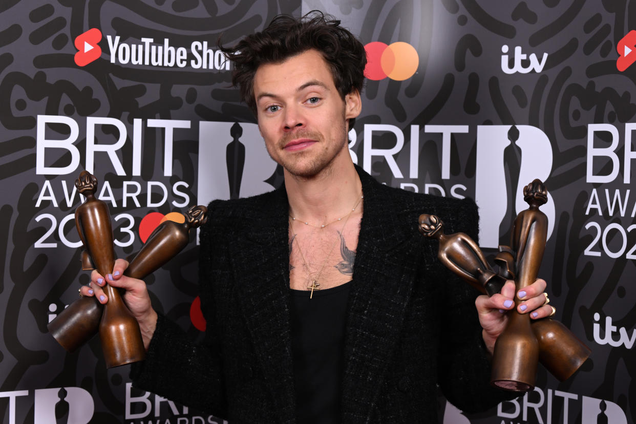 Harry Styles poses with the awards for British Pop/R&B Act, British Artist of the Year, Song of the Year and Album of the Year in the media room during The BRIT Awards 2023 at The O2 Arena 