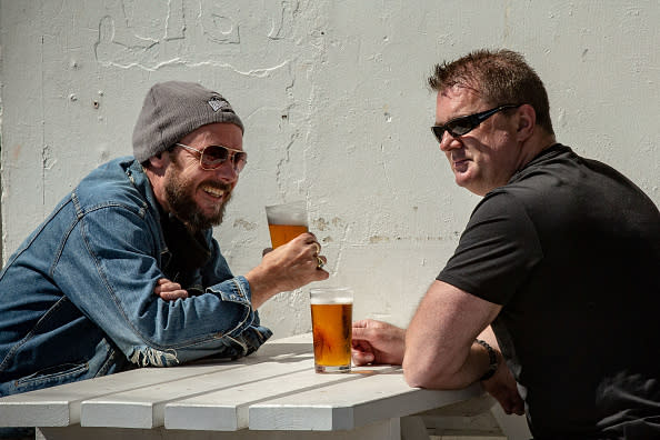 People enjoy a drink at The Esplanade Hotel in St Kilda in Melbourne, Australia.