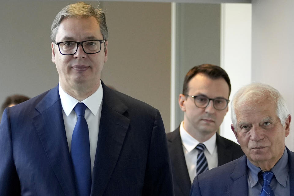 Serbia's President Aleksandar Vucic, left, walks with European Union foreign policy chief Josep Borrell, right, prior to a meeting in Brussels, Thursday, Sept. 14, 2023. The leaders of Serbia and Kosovo are holding a fresh round of meetings on Thursday aimed at improving their strained relations as calls mount for a change in the Western diplomatic approach toward them amid concern that their tensions could spiral out of control. (AP Photo/Virginia Mayo)