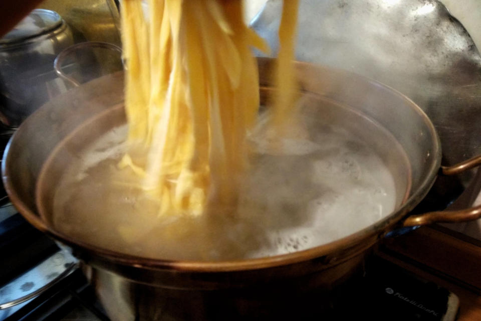 Close-up of pasta being boiled.