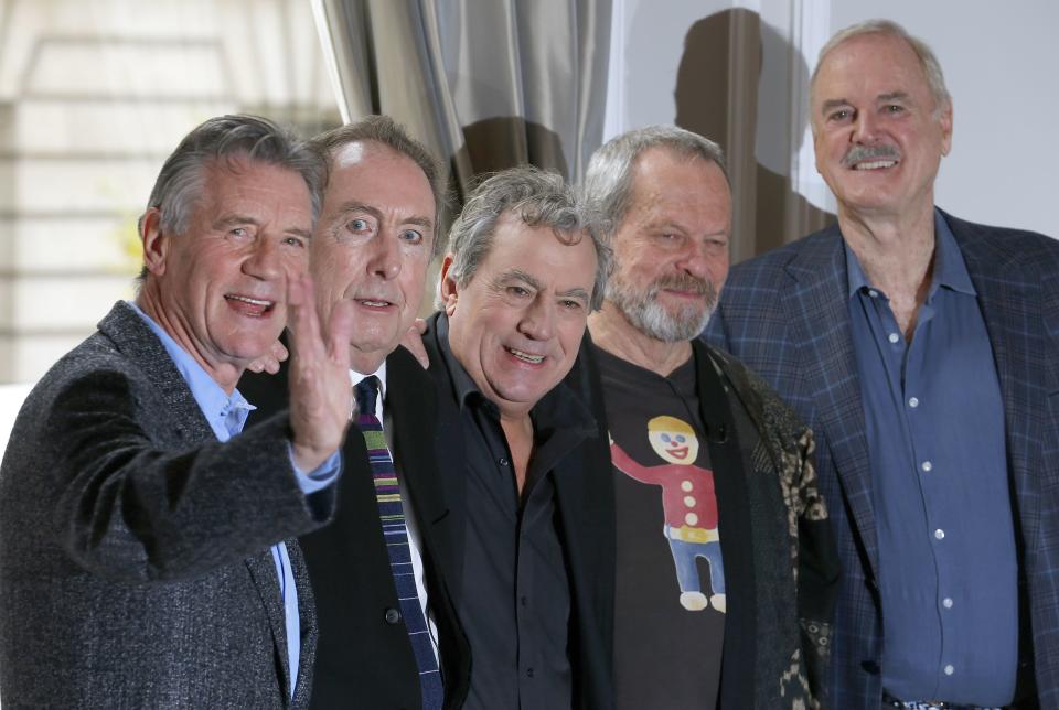 The surviving members of the original cast of the Monty Python comedy team (L-R) Michael Palin, Eric Idle, Terry Jones, Terry Gilliam and John Cleese, pose for photographers at a photocall in central London November 21, 2013. REUTERS/Andrew Winning (BRITAIN – Tags: ENTERTAINMENT SOCIETY)