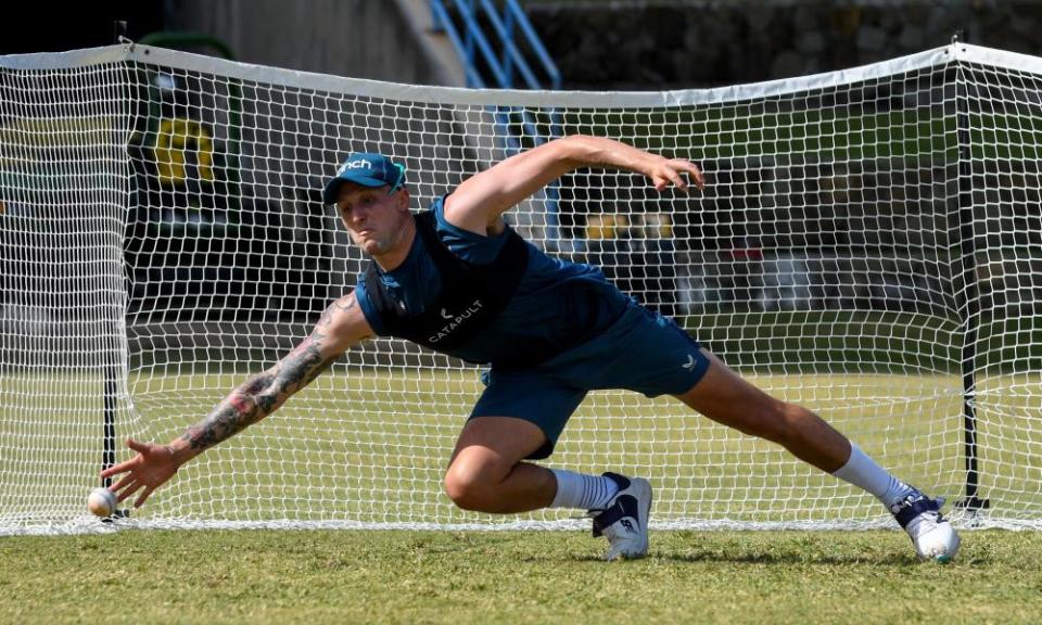 Brydon Carse dives for a catch during a training session at the Sir Vivian Richards Cricket Stadium