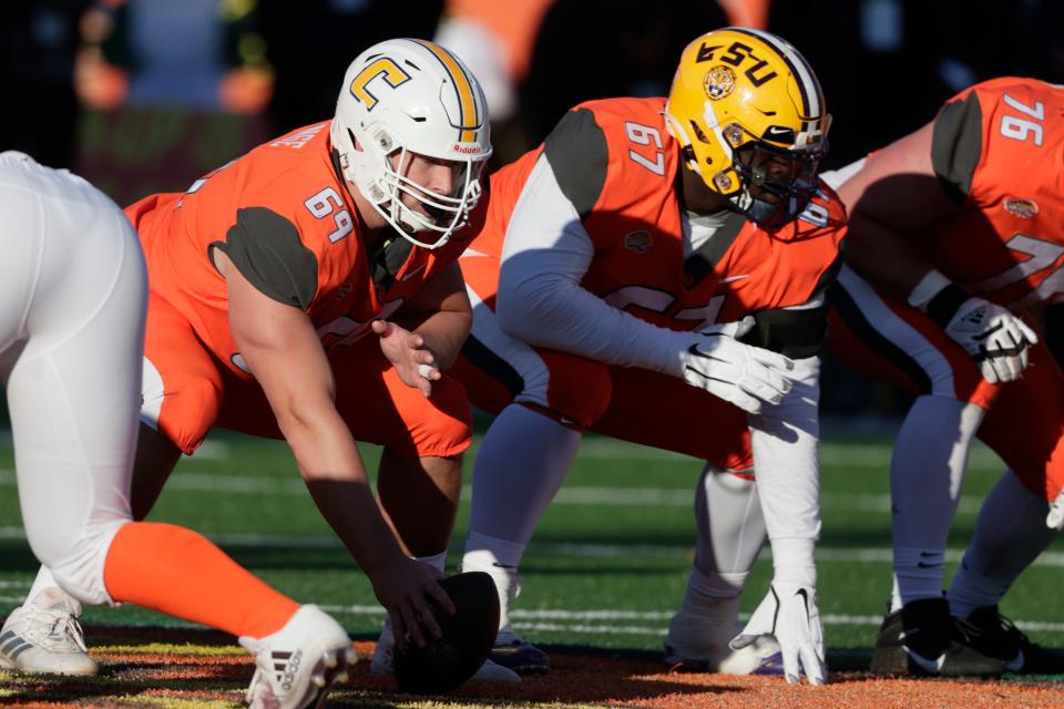 National Team offensive lineman Cole Strange of Tennessee-Chattanooga (69) and National Team offensive lineman Chasen Hines of LSU (67) in an NCAA college football game Saturday, Feb. 5, 2022, in Mobile, Ala. (AP Photo/Butch Dill)