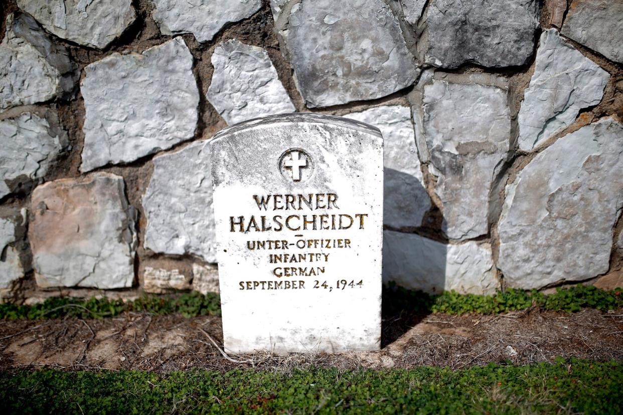 A grave of a World War II POW is pictured March 10 at the Fort Reno Cemetery in El Reno. According to the Oklahoma Historical Society, an estimated 20,000 German POWs were brought to Oklahoma during World War II and held at eight base camps. Fort Reno was among the eight.