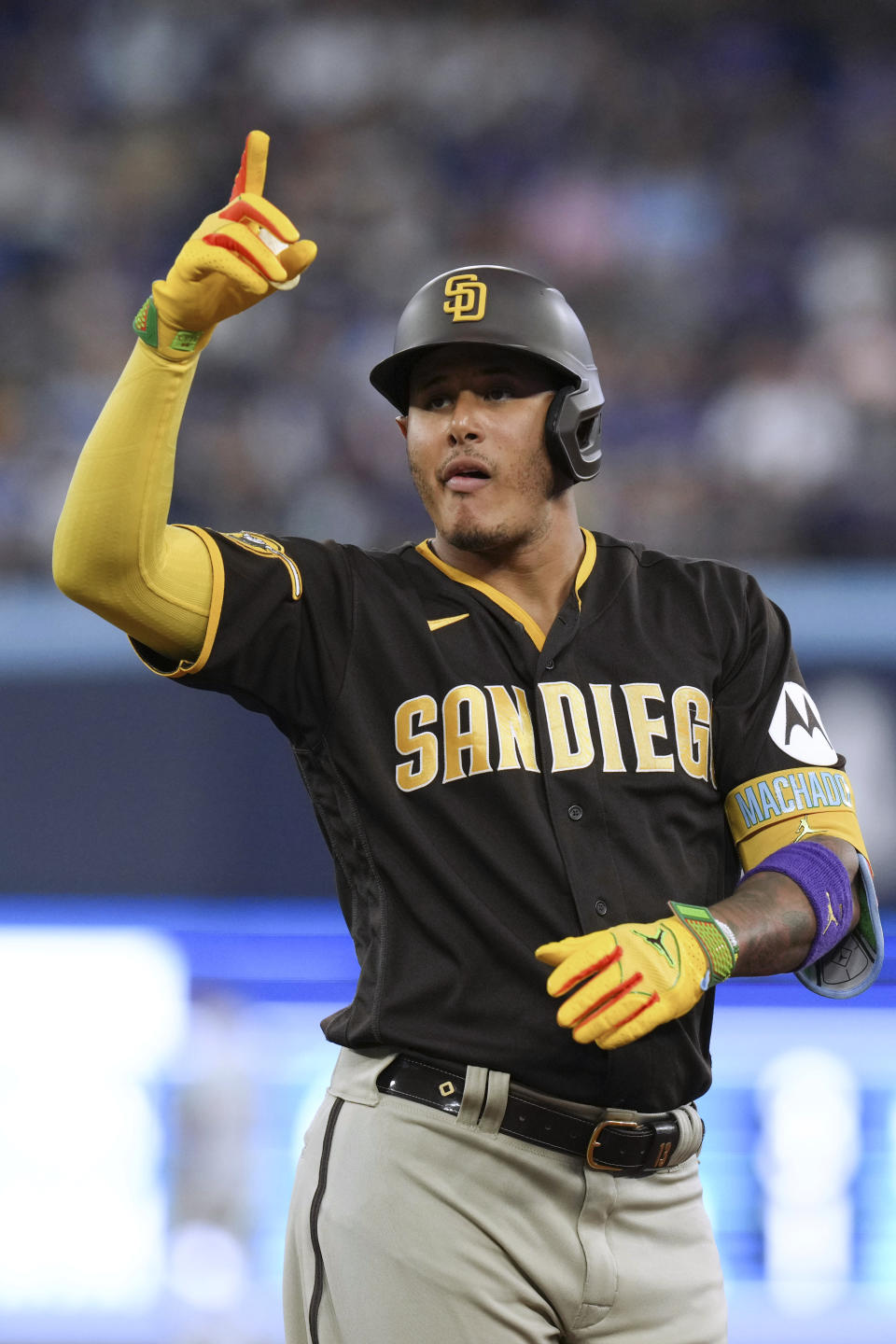 San Diego Padres' Manny Machado celebrates his two-run single against the Toronto Blue Jays during the fifth inning of a baseball game Wednesday, July 19, 2023, in Toronto. (Chris Young/The Canadian Press via AP)