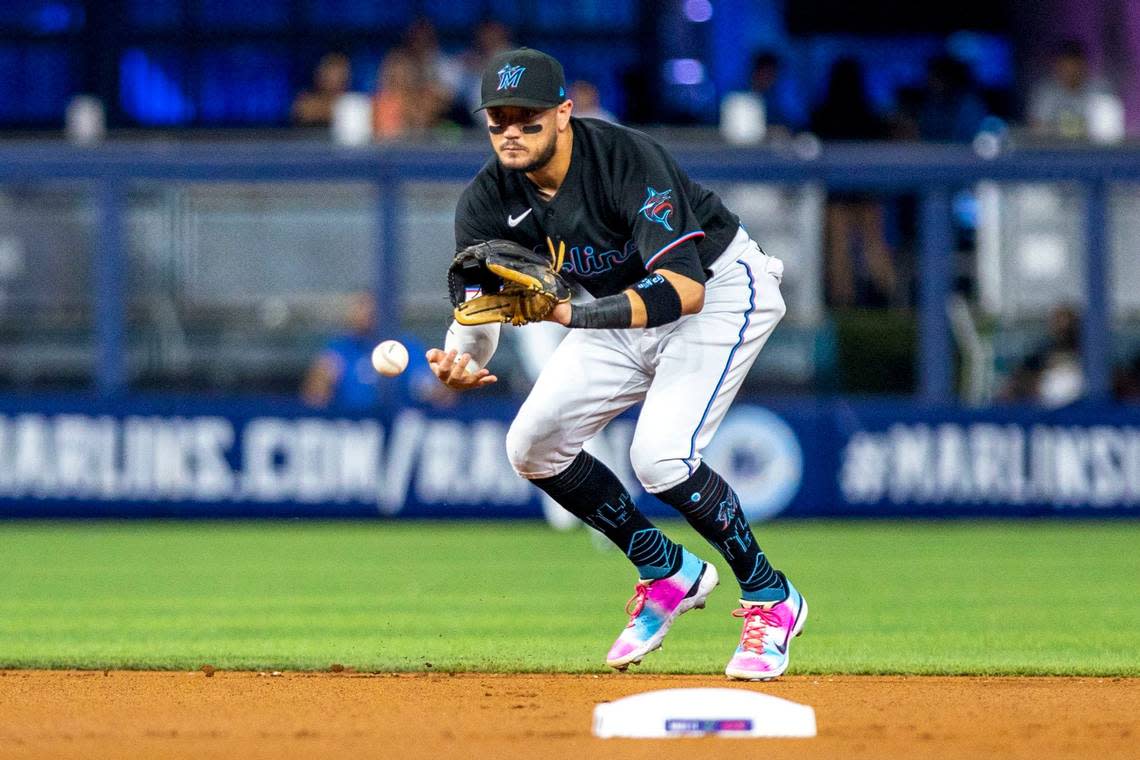 Miami Marlins shortstop Miguel Rojas (11) catches the ground ball during the first inning of an MLB game against the New York Mets at loanDepot park in the Little Havana neighborhood of Miami, Florida, on Friday, September 9, 2022.