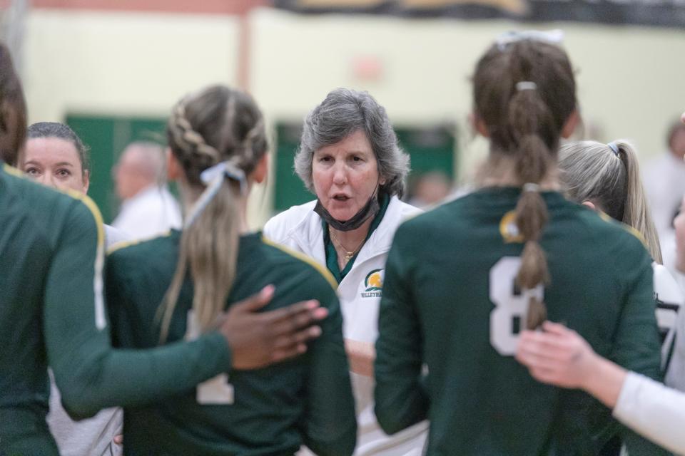 St. Mark's coach Nancy Griskowitz huddles with her team.