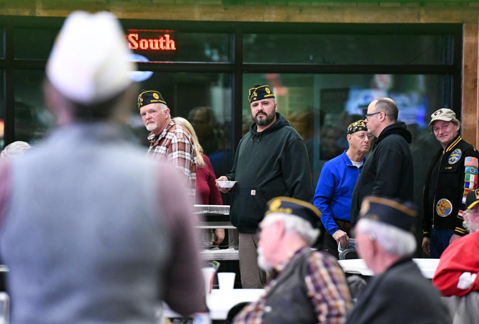 Brian Mehnert listesns as Courtney Steffen speaks on Tuesday, March 21, 2023, at the Military Heritage Alliance in Sioux Falls.