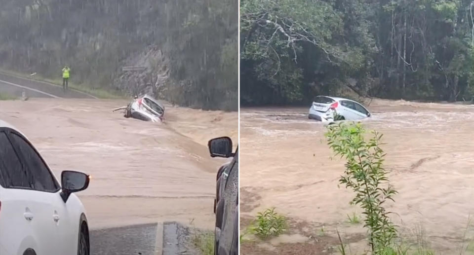 A car being swept away by floodwaters.