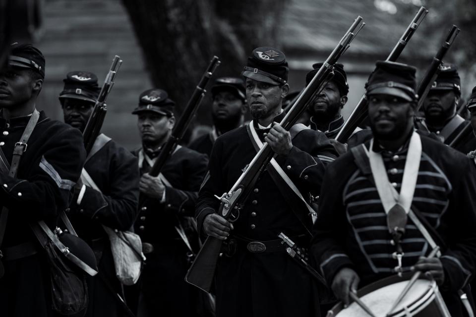 A formerly enslaved man (Will Smith, center) ends up in an all-Black Union regiment after escaping in the period drama "Emancipation."