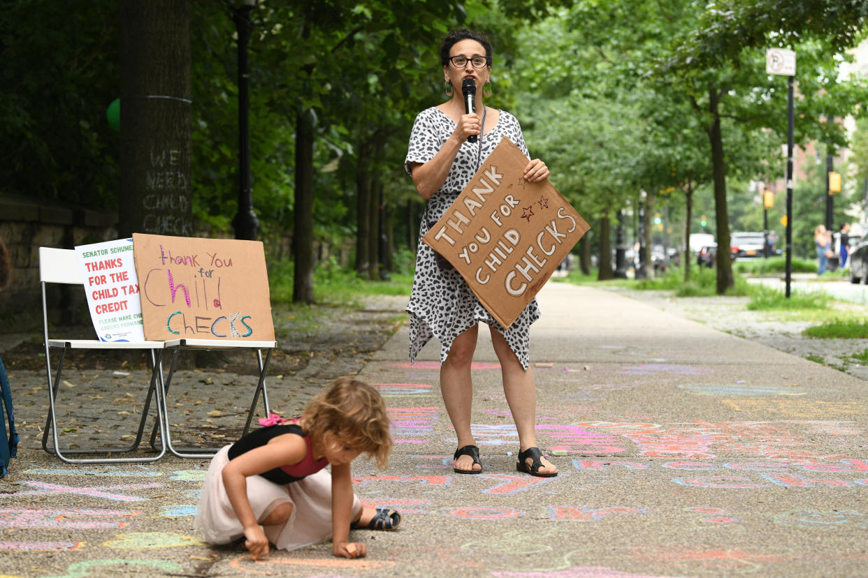 Parents celebrate new monthly Child Tax Credit payments and urge Congress to make them permanent on July 12, 2021. (Photo by Bryan Bedder/Getty for ParentsTogether)