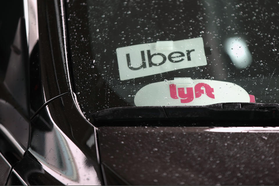 CHICAGO, ILLINOIS - APRIL 10: A ride share driver picks up passengers at O'Hare Airport on April 10, 2019 in Chicago, Illinois. In response to the death of 21-year-old University of South Carolina student Samantha Josephson, the South Carolina House has approved a bill that would require Uber, Lyft and other ride sharing vehicles to have illuminated signs. Josephson was killed after climbing into a vehicle that she thought was her Uber ride.  (Photo by Scott Olson/Getty Images)