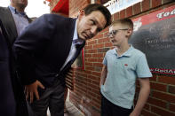 Florida Gov. Ron DeSantis leans in to listen to Elliot Perry outside the Red Arrow Diner during a visit to Manchester, N.H., Friday, May 19, 2023. (AP Photo/Robert F. Bukaty)