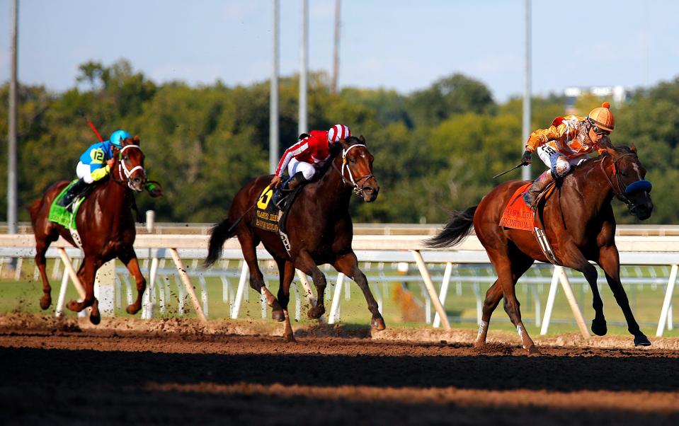 Rafael Bejarano rides Tonito M. as they lead during the Oklahoma Derby at Remington Park in 2014.