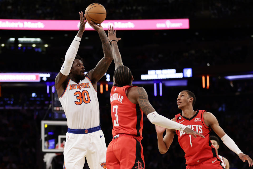 New York Knicks forward Julius Randle (30) shoots over Houston Rockets guard Kevin Porter Jr. (3) during the second half of an NBA basketball game Monday, March 27, 2023, in New York. (AP Photo/Adam Hunger)