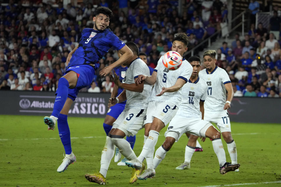 United States forward Ricardo Pepi (9) tries to direct a head ball to the goal against El Salvador's Roberto Dominguez (3), Nelson Blanco (5), Christian Martinez (14) and Jairo Henriquez (17) during the second half of a CONCACAF Nations League soccer match Monday, March 27, 2023, in Orlando, Fla. (AP Photo/John Raoux)