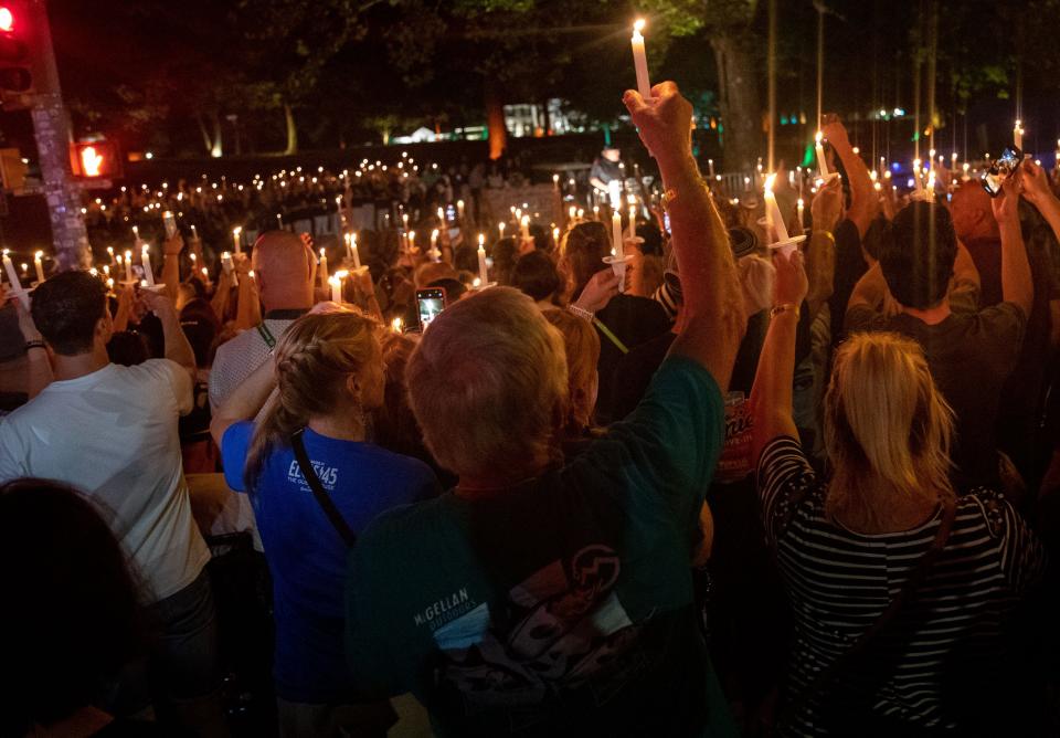 Fans light candles during the Candlelight Vigil ceremony marking the 45th anniversary of Elvis Presley's death Monday, Aug. 15, 2022, at Graceland in Memphis.