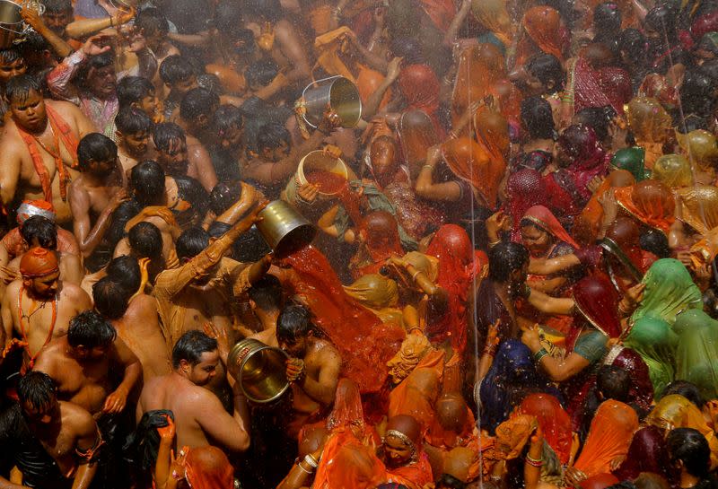 FILE PHOTO: Hindu devotees take part in 'Huranga' at Dauji temple near Mathura