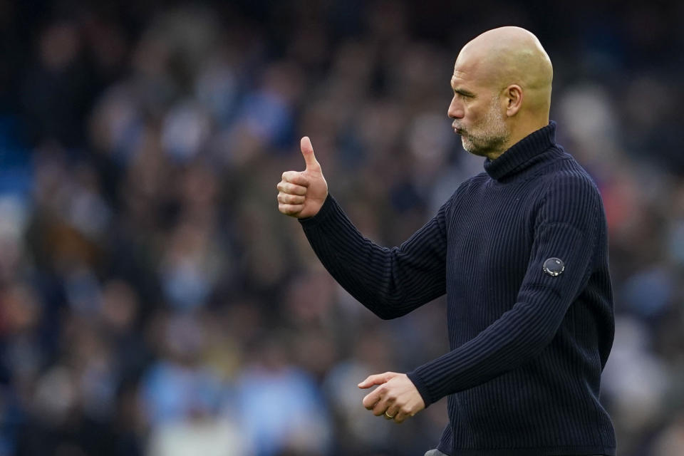 Manchester City's head coach Pep Guardiola gestures at the end of the English Premier League soccer match between Manchester City and Arsenal at the Etihad stadium in Manchester, England, Sunday, March 31, 2024. (AP Photo/Dave Thompson)