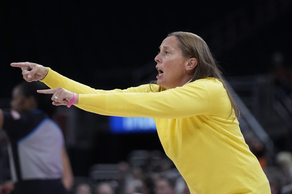 Long Beach State head coach Amy Wright signals to her players during the first half of an NCAA college basketball game in Austin, Texas, Wednesday, Dec. 6, 2023. (AP Photo/Eric Gay)