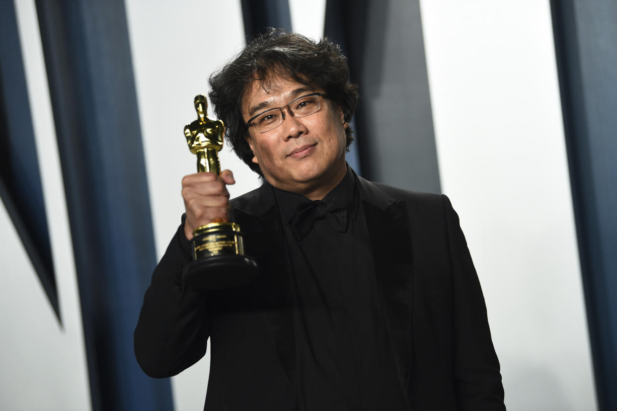 Bong Joon-ho, winner of the awards for best original screenplay, best international feature film, best directing, and best picture for "Parasite," arrives at the Vanity Fair Oscar Party on Sunday, Feb. 9, 2020, in Beverly Hills, Calif. (Photo by Evan Agostini/Invision/AP)