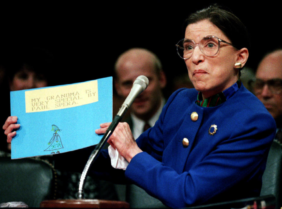 US Supreme Court nominee Ruth Bader Ginsburg holds up a drawing of herself with the words "My Grandmother Is Very Special by Paul Spera" as she appears before the Senate Judiciary Committee July 20, 1993, on Capitol Hill, on the first day of Ginsburg's confirmation hearings. Paul is Ginsburg's grandson.