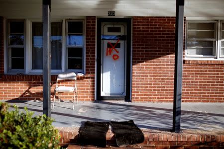 A home is labeled with evacuation markings along Herbert Street after Hurricane Matthew caused severe flooding in Goldsboro, North Carolina, U.S. October 13, 2016. REUTERS/Randall Hill