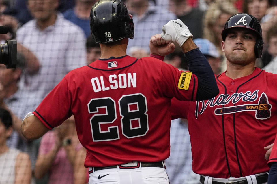 Atlanta Braves' Matt Olson (28) celebrates with teammate Austin Riley, right, after hitting a grand slam in the first inning of a baseball game against the Chicago White Sox, Friday, July 14, 2023, in Atlanta. (AP Photo/John Bazemore)