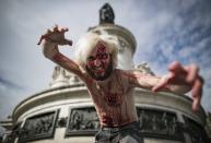 <p>People in costume take part in a walk for World Zombie Day 2017, on Place de la Républiquei n Paris, France, Oct. 7, 2017. (Photo: EFE/EPA/IAN LANGSDON) </p>