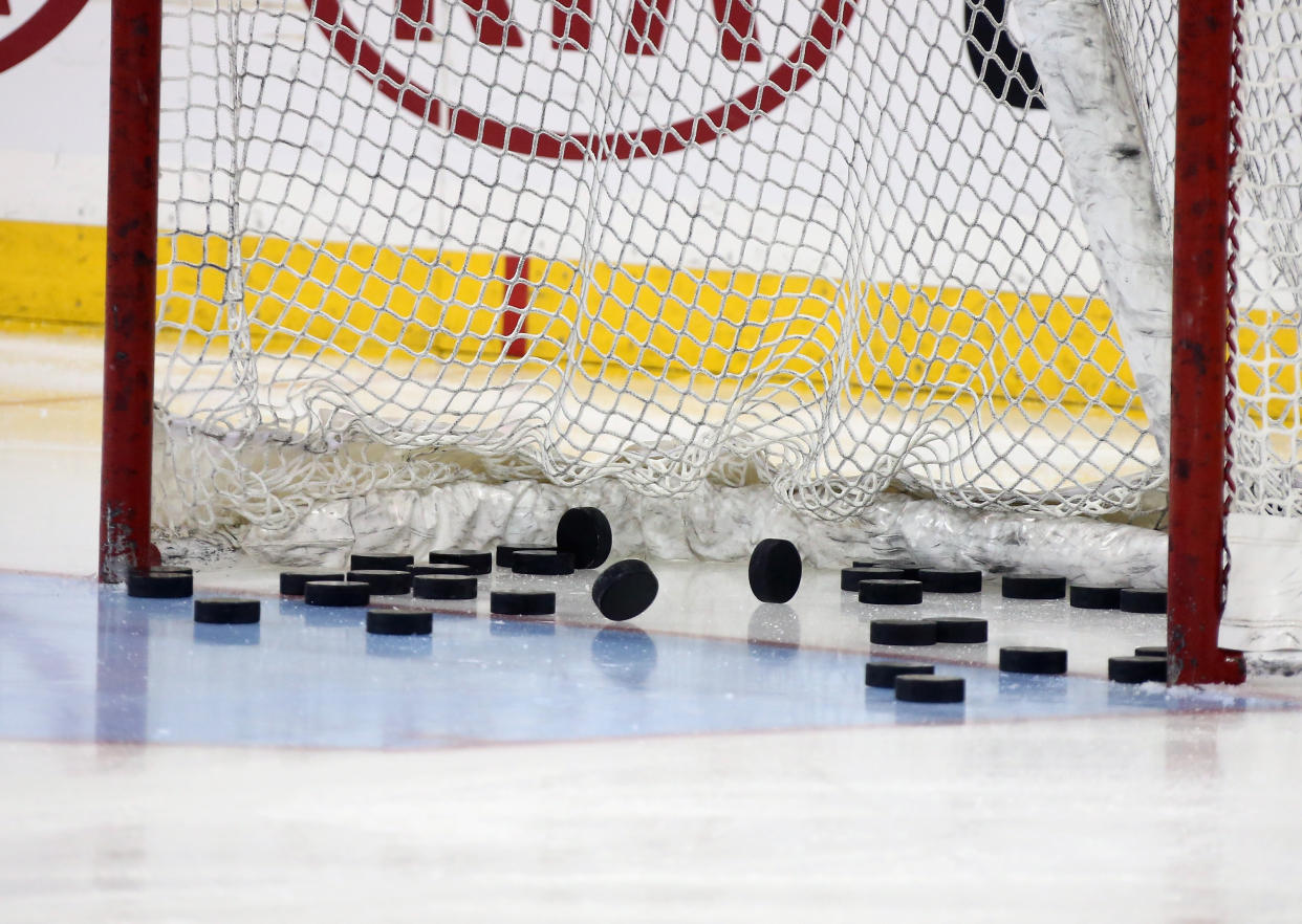 NEW YORK, NY - FEBRUARY 26: Pucks sit in the net prior to the game between the New York Rangers and the Arizona Coyotes at Madison Square Garden on February 26, 2015 in New York City. The Rangers defeated the Coyotes 4-3.  (Photo by Bruce Bennett/Getty Images)