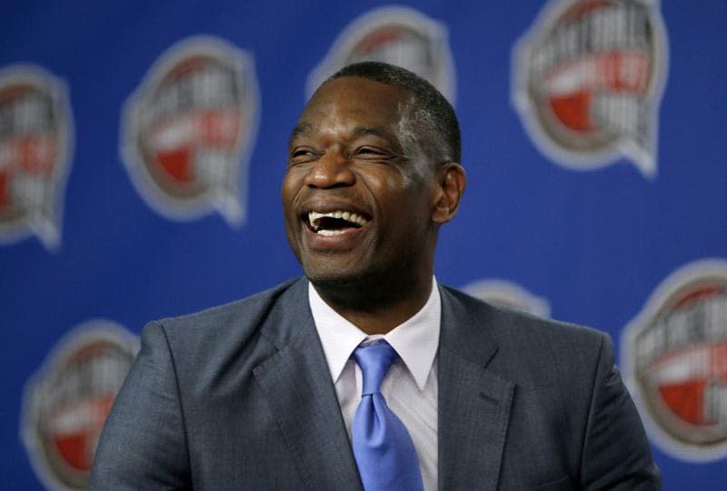 Former NBA basketball player Dikembe Mutombo laughs during a news conference announcing him as one of the 12 finalists of this year’s hall of fame class during an event ahead of the NBA All Star basketball game, on Feb. 14, 2015, in New York. Mutombo is undergoing treatment in Atlanta for a brain tumor, the NBA announced Saturday, OCt. 15, 2022, (AP Photo/Julio Cortez)