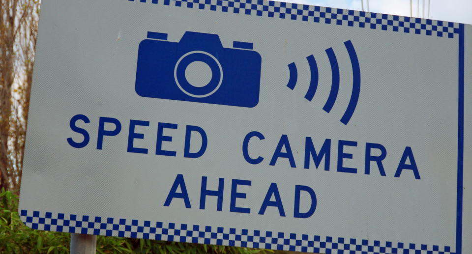 A speed camera sign.