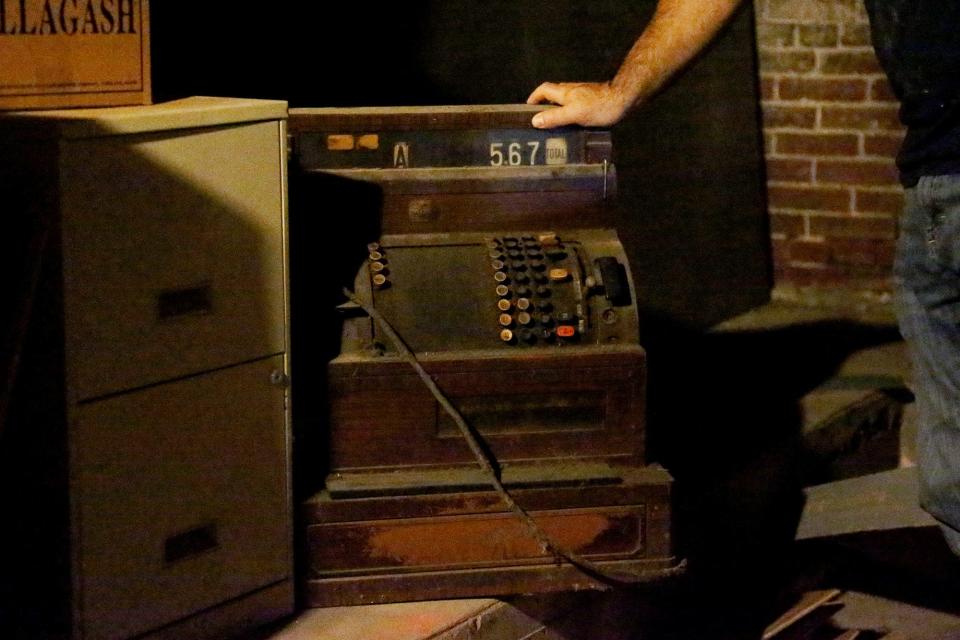 An old cash register can be found in the basement. The Greg and Beth Danilowski plan to find a place to put these antiques on display in the re-opened store.