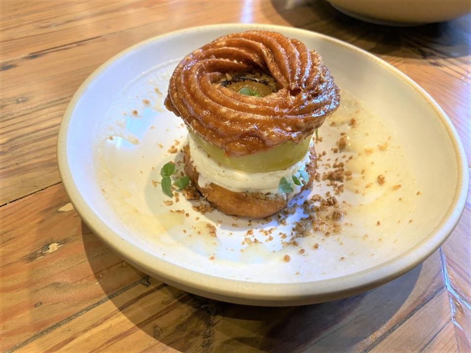 "Cruller Intentions" is an apple cruller ice cream sandwich that is part of the new line-up of desserts at The Jones Assembly.