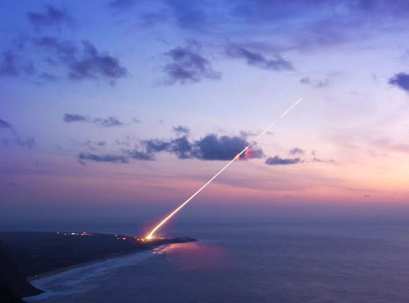 THAAD antiballistic system launches over water.