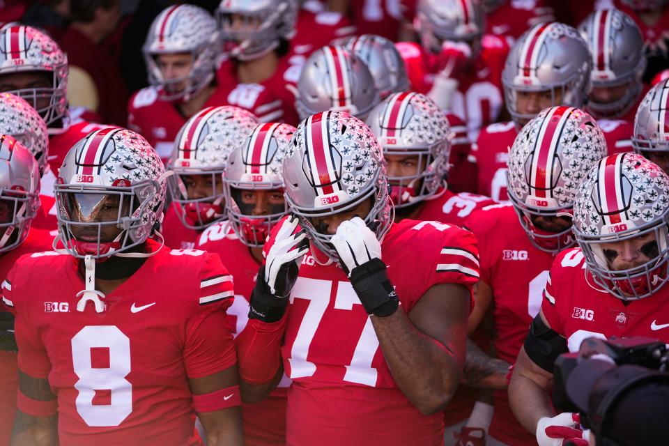 Nov 26, 2022; Columbus, Ohio, USA; Ohio State Buckeyes offensive lineman Paris Johnson Jr. (77) prepares to take the field for warm-ups prior to the NCAA football game against the Michigan Wolverines at Ohio Stadium. Mandatory Credit: Adam Cairns-The Columbus Dispatch