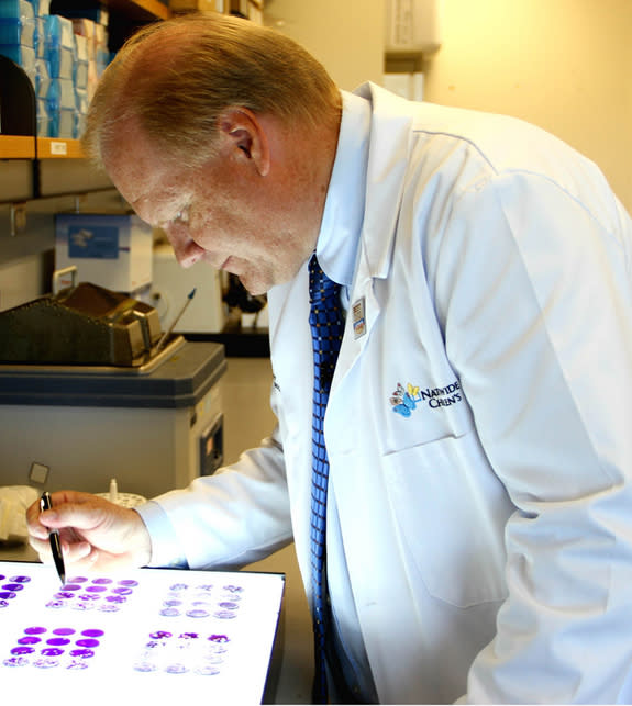 Timothy Cripe, M.D., Ph.D., of Nationwide Children's Hospital, analyzes the effect viruses have on cancer cells in the laboratory. Cripe says altered versions of the herpes simplex virus, when injected into tumors, can alert the body to cancer'