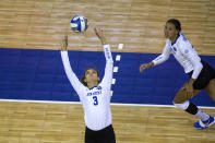 Kentucky'sMadison Lilley (3) sets the ball for Madi Skinner (2) during the first set against Washington in a semifinal in the NCAA women's volleyball championships Thursday, April 22, 2021, in Omaha, Neb. (AP Photo/John Peterson)