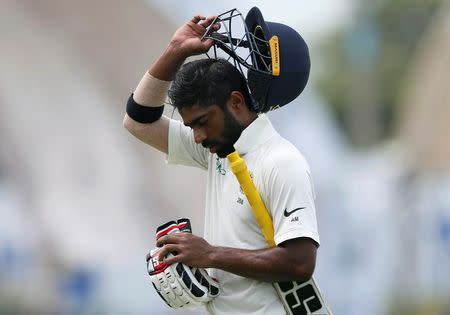 Cricket - Sri Lanka v India - First Test Match - Galle, Sri Lanka - July 26, 2017 - India's cricketer Abhinav Mukund reacts as he walks off the field after his dismissal by Sri Lanka's Nuwan Pradeep (not pictured). REUTERS/Dinuka Liyanawatte