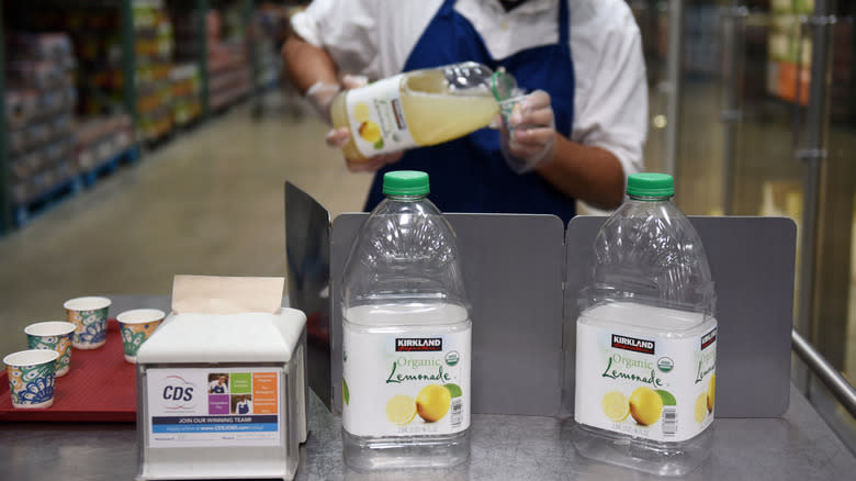 Costco employee serving lemonade