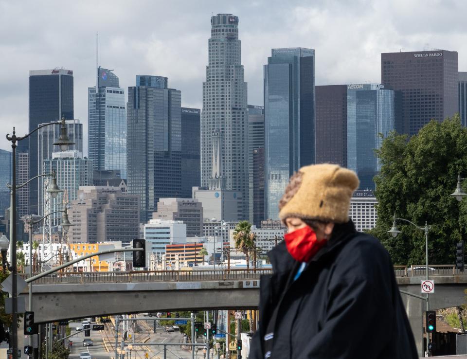 A pedestrian in Boyle Heights is bundled up for the cold in Los Angeles, California.