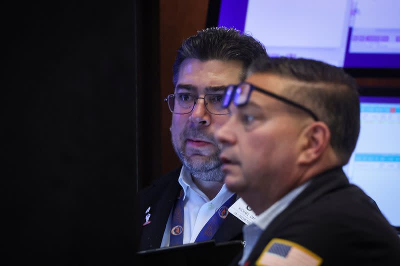 Traders work on the floor of the NYSE in New York City