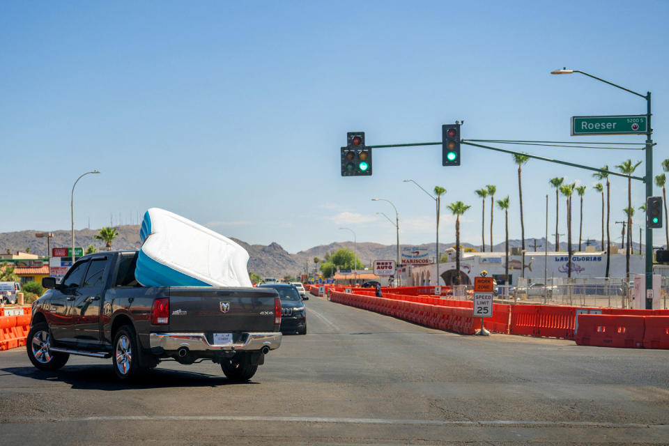 Image: A pickup truck with an inflatable pool in Phoenix on July 15. (Brandon Bell / Getty Images file)
