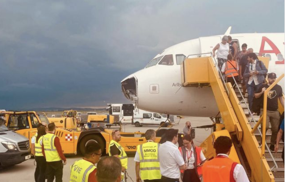 An Austrian Airlines flight was left with shattered cockpit windows and a torn-apart nose after it encountered a hail storm on June 9, 2024.  / Credit: Anonymous via Storyful