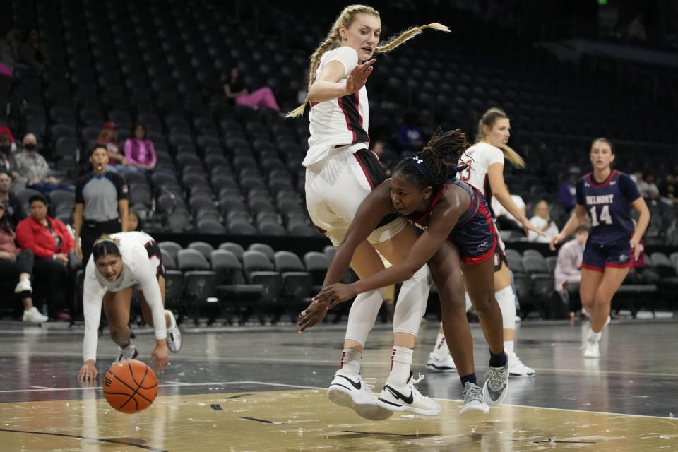 Belmont guard Tuti Jones, right passes around Stanford forward Cameron Brink during the second half of an NCAA college basketball game Wednesday, Nov. 22, 2023, in Henderson, Nev. (AP Photo/John Locher)