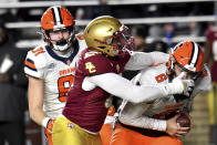 Boston College's Donovan Ezeiruaku sacks Sayracuse quarterback Garrett Shrader during the first half of an NCAA college football game Saturday, Nov. 26, 2022, in Boston. (AP Photo/Mark Stockwell)