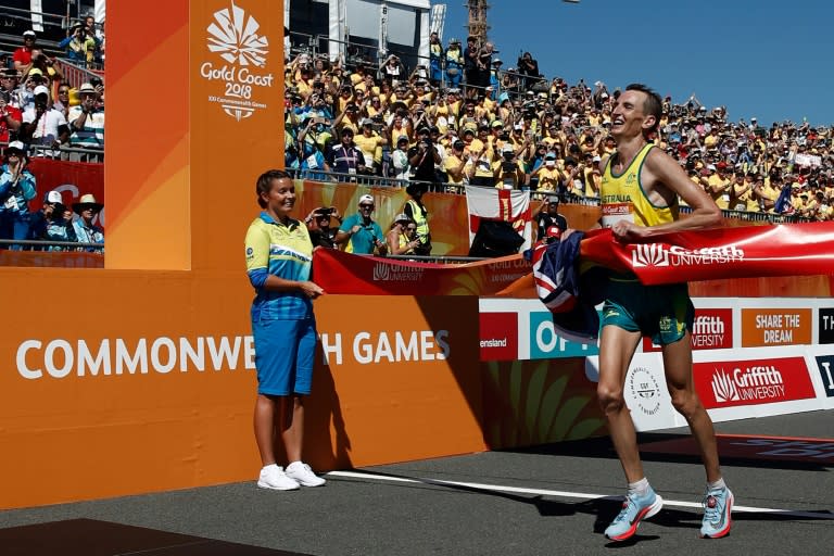 Australia's Michael Shelley crosses the finish line to win the men's marathon during the 2018 Gold Coast Commonwealth Games