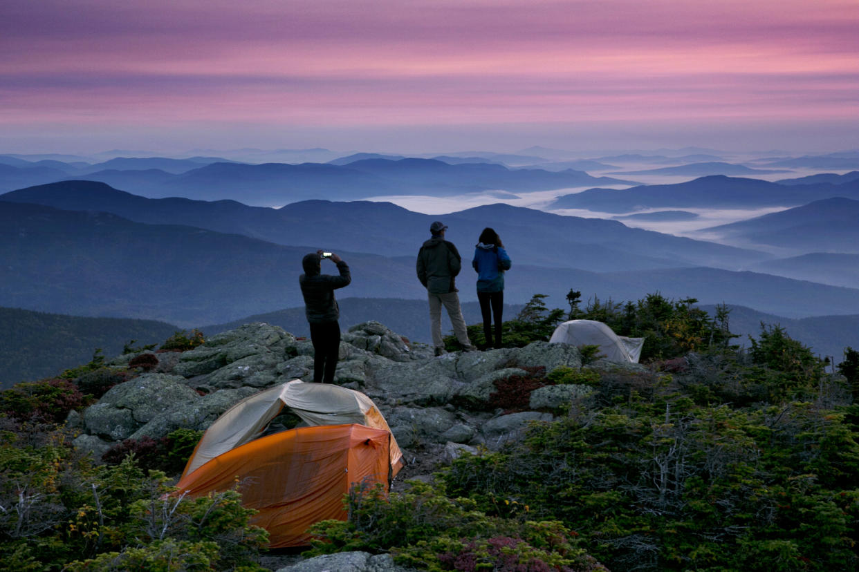 Backpackers at their campsite just before sunrise on the Appalachian Trail in Beans Purchase Township, N.H. (Photo: Robert F. Bukaty/AP)