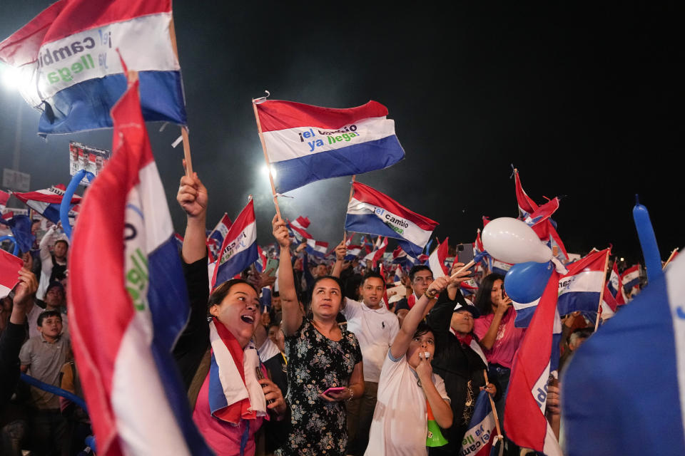 Followers of Efrain Alegre, presidential candidate for the Concertacion coalition, wave Paraguayan flags during Alegre´s closing campaign rally in Asuncion, Paraguay, Thursday, April 27, 2023. Paraguay's general elections are scheduled for April 30th. (AP Photo/Jorge Saenz)